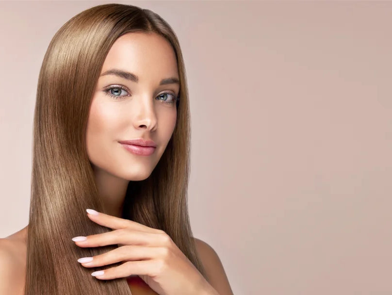 A beautiful woman with long, straight hair, exuding elegance and confidence in a serene setting.